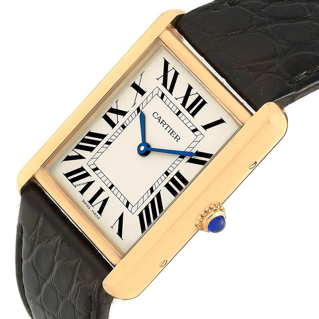 The image shows a close-up of the Cartier Tank Solo W1018855 Steel and Gold (two tone) Silver Dial W1018855 Steel and Gold (two tone) Silver Dial watch at an angled view, highlighting its rectangular face, Roman numerals, and crown.