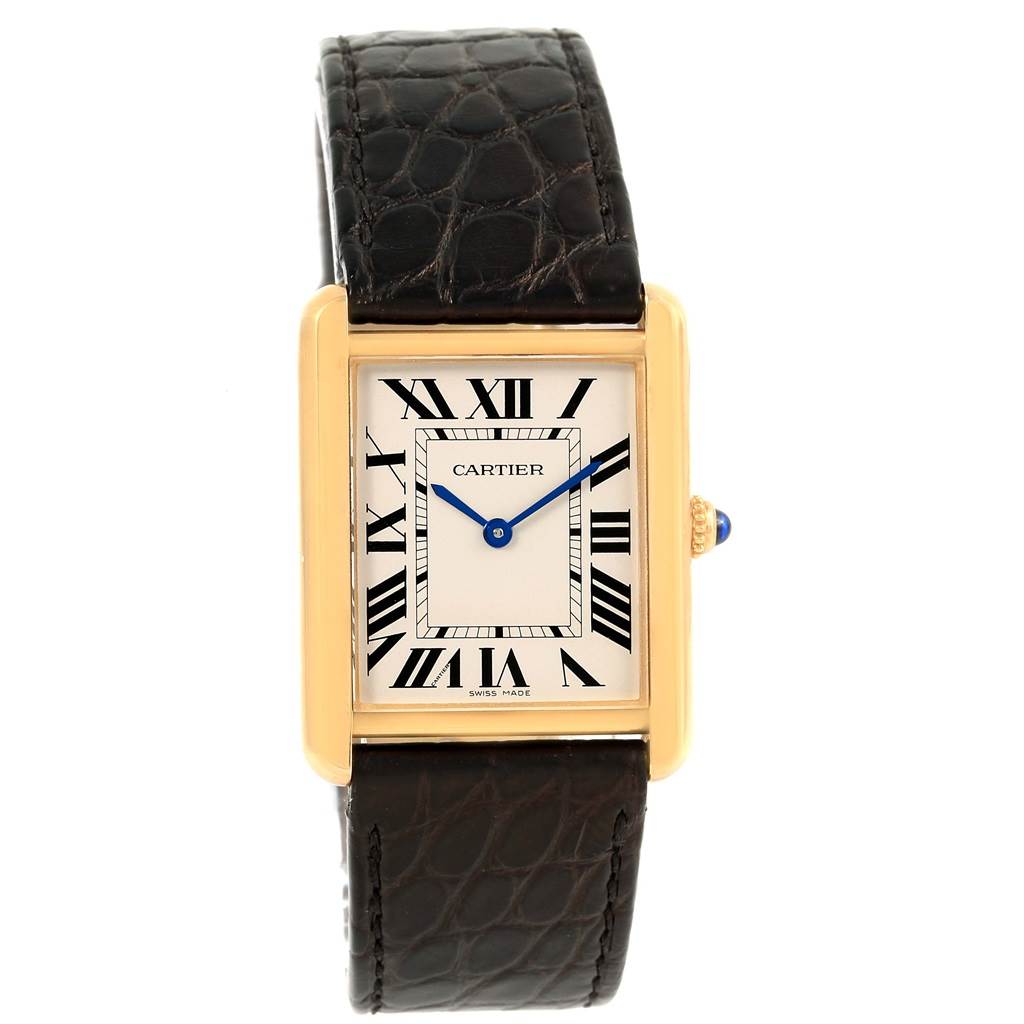 This Cartier Tank Solo W1018855 Steel and Gold (two tone) Silver Dial W1018855 Steel and Gold (two tone) Silver Dial watch is shown from a front angle, highlighting its rectangular face, Roman numerals, and black leather strap.