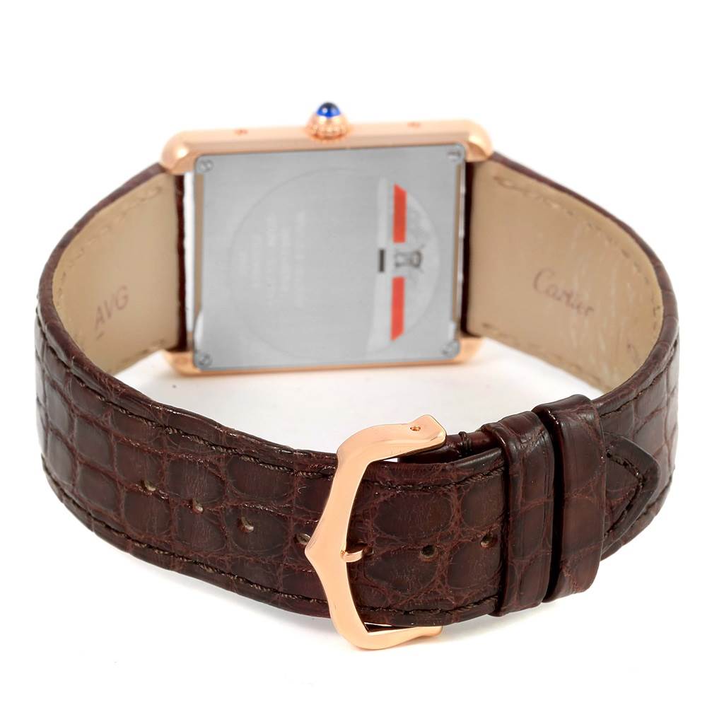 The image shows the back view of the Cartier Tank Solo W5200025 Steel and Gold (two tone) Silver Dial W5200025 Steel and Gold (two tone) Silver Dial watch, highlighting its leather strap and buckle.