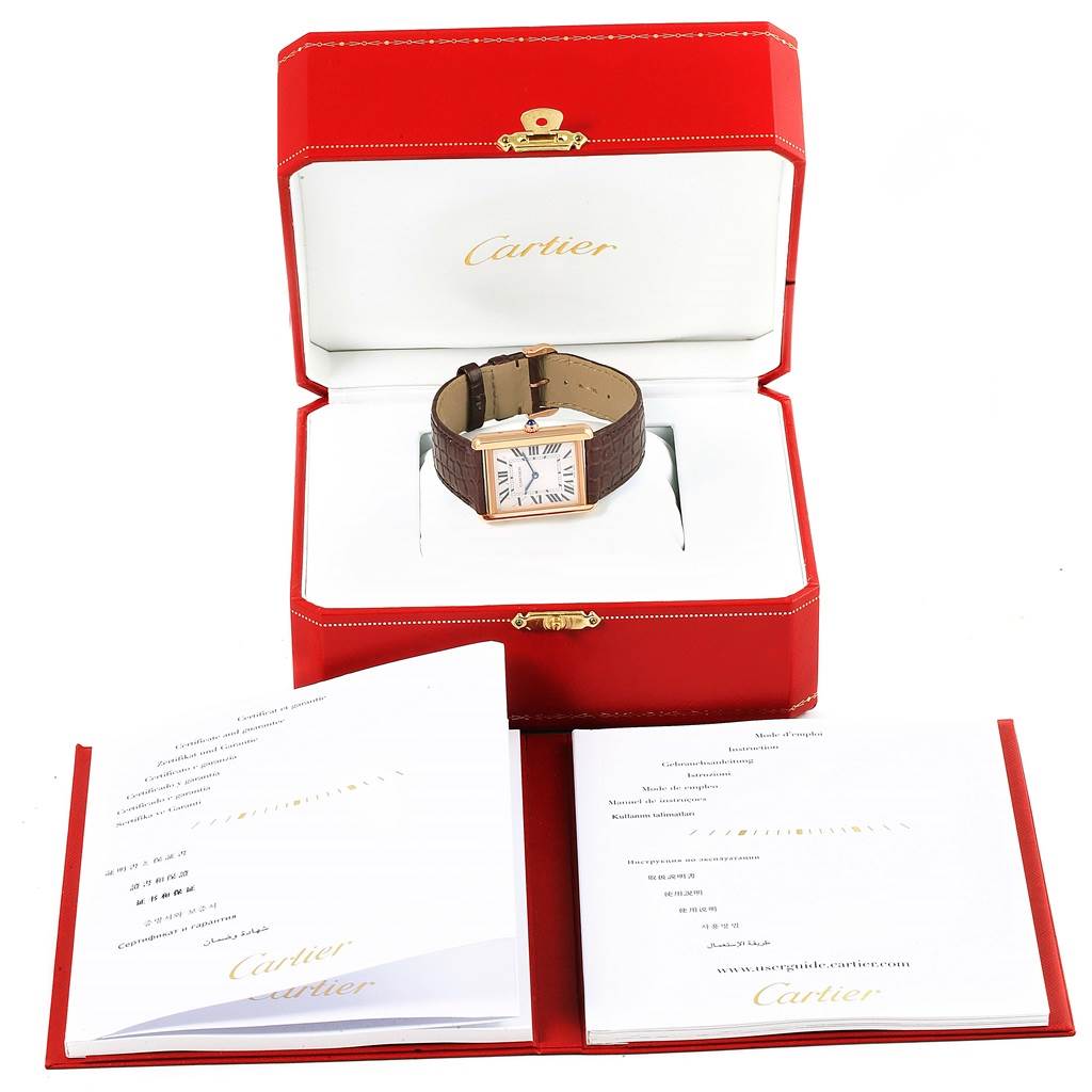 The Cartier Tank Solo W5200025 Steel and Gold (two tone) Silver Dial W5200025 Steel and Gold (two tone) Silver Dial watch is displayed in its case, with accompanying documents shown below the box.