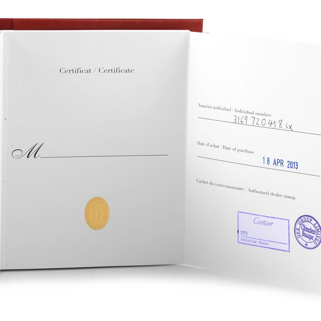 The image shows an open certificate booklet for the Cartier Tank Solo W1018355 Stainless Steel Silver Dial W1018355 Stainless Steel Silver Dial watch model, displaying the purchase date and dealer stamps.