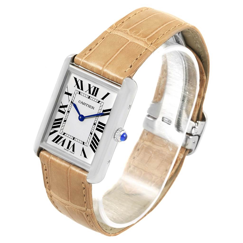 The Cartier Tank Solo W1018355 Stainless Steel Silver Dial W1018355 Stainless Steel Silver Dial watch is shown at a slight angle, revealing its rectangular face, Roman numerals, blue hands, and leather strap.