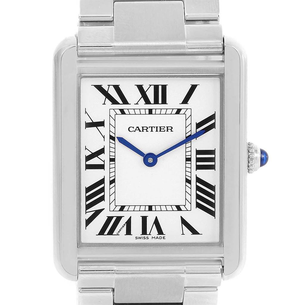 This image shows a close-up of the face and bezel of a Cartier Tank Solo W5200014 Stainless Steel Silver Dial W5200014 Stainless Steel Silver Dial watch, displaying its Roman numerals and blue hands.