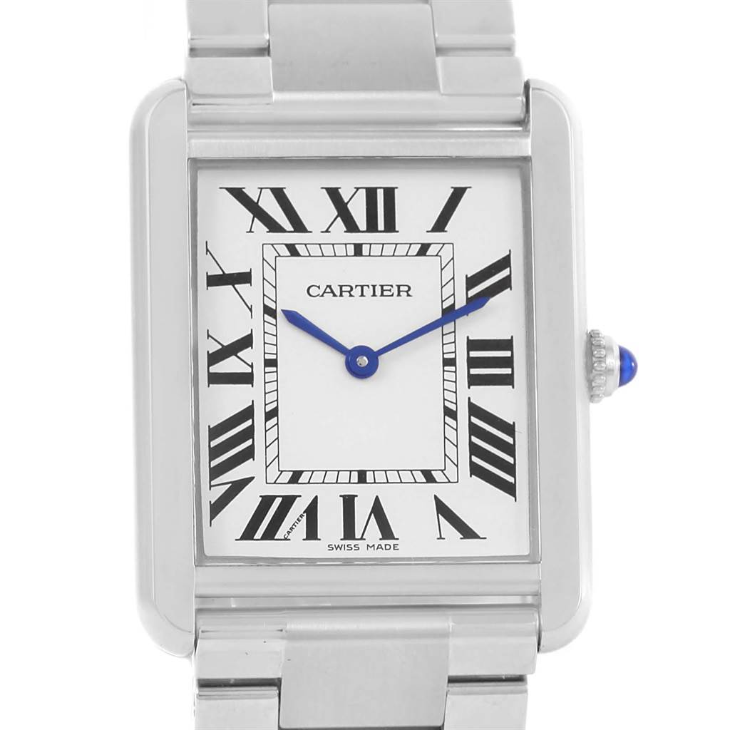 This is a close-up of the face of a Cartier Tank Solo W5200014 Stainless Steel Silver Dial W5200014 Stainless Steel Silver Dial watch, showing the Roman numerals, blue hands, and part of the metal bracelet.