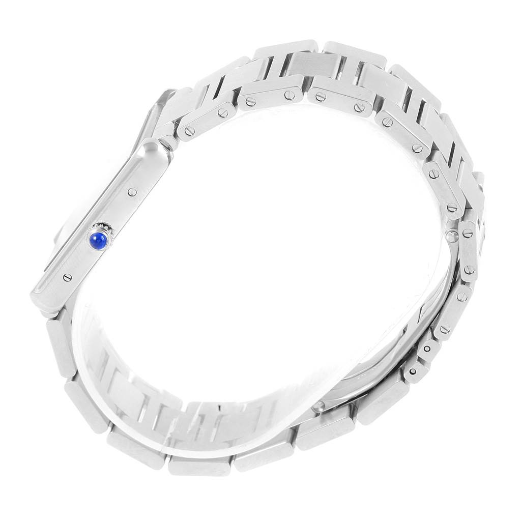 The image shows a side view of the Cartier Tank Solo W5200014 Stainless Steel Silver Dial W5200014 Stainless Steel Silver Dial watch, highlighting the metal bracelet and crown with a blue cabochon.