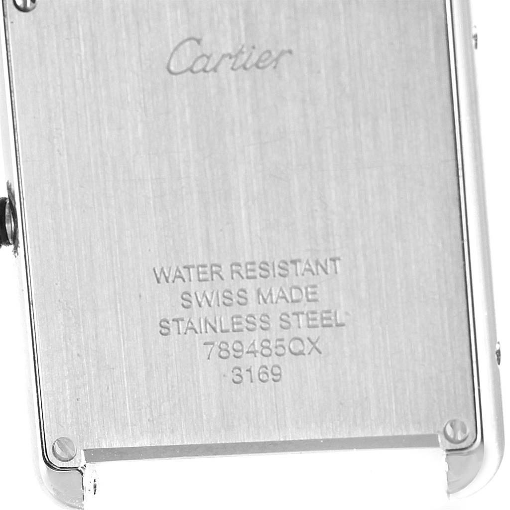 The image shows the back case of a Cartier Tank Solo W5200014 Stainless Steel Silver Dial W5200014 Stainless Steel Silver Dial watch, emphasizing its engravings and stainless steel surface.