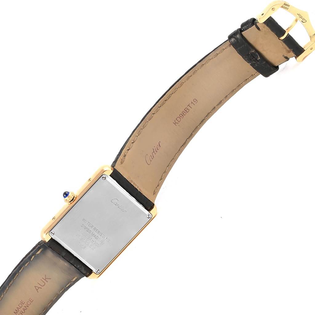 The image shows the back view of a Cartier Tank Solo W1018855 Steel and Gold (two tone) Silver Dial W1018855 Steel and Gold (two tone) Silver Dial watch, displaying its case back, leather strap, and buckle.