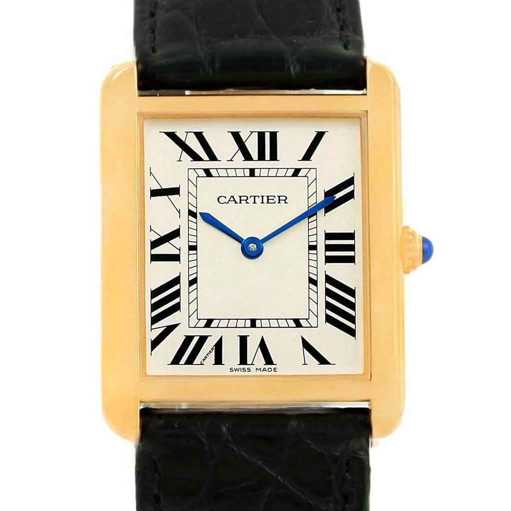This image shows a front view of the Cartier Tank Solo W1018855 Steel and Gold (two tone) Silver Dial W1018855 Steel and Gold (two tone) Silver Dial watch, featuring its rectangular face, Roman numerals, blue hands, and black strap.