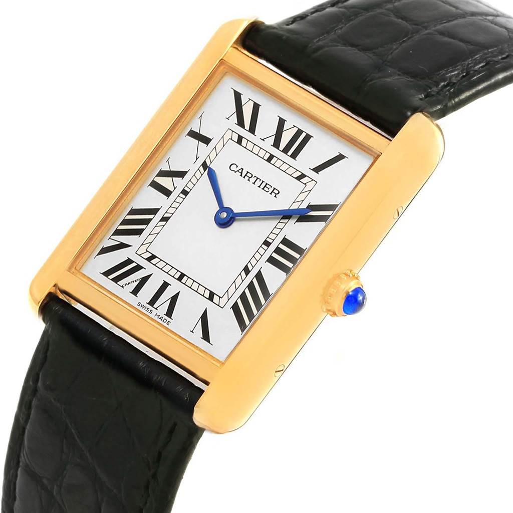 The image shows a close-up angle of a Cartier Tank Solo W1018855 Steel and Gold (two tone) Silver Dial W1018855 Steel and Gold (two tone) Silver Dial watch, including its rectangular face, Roman numerals, and black leather strap.