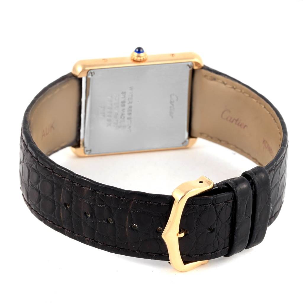 The image shows the back view of a Cartier Tank Solo W1018855 Steel and Gold (two tone) Silver Dial W1018855 Steel and Gold (two tone) Silver Dial watch, highlighting the case back, leather strap, and gold buckle.