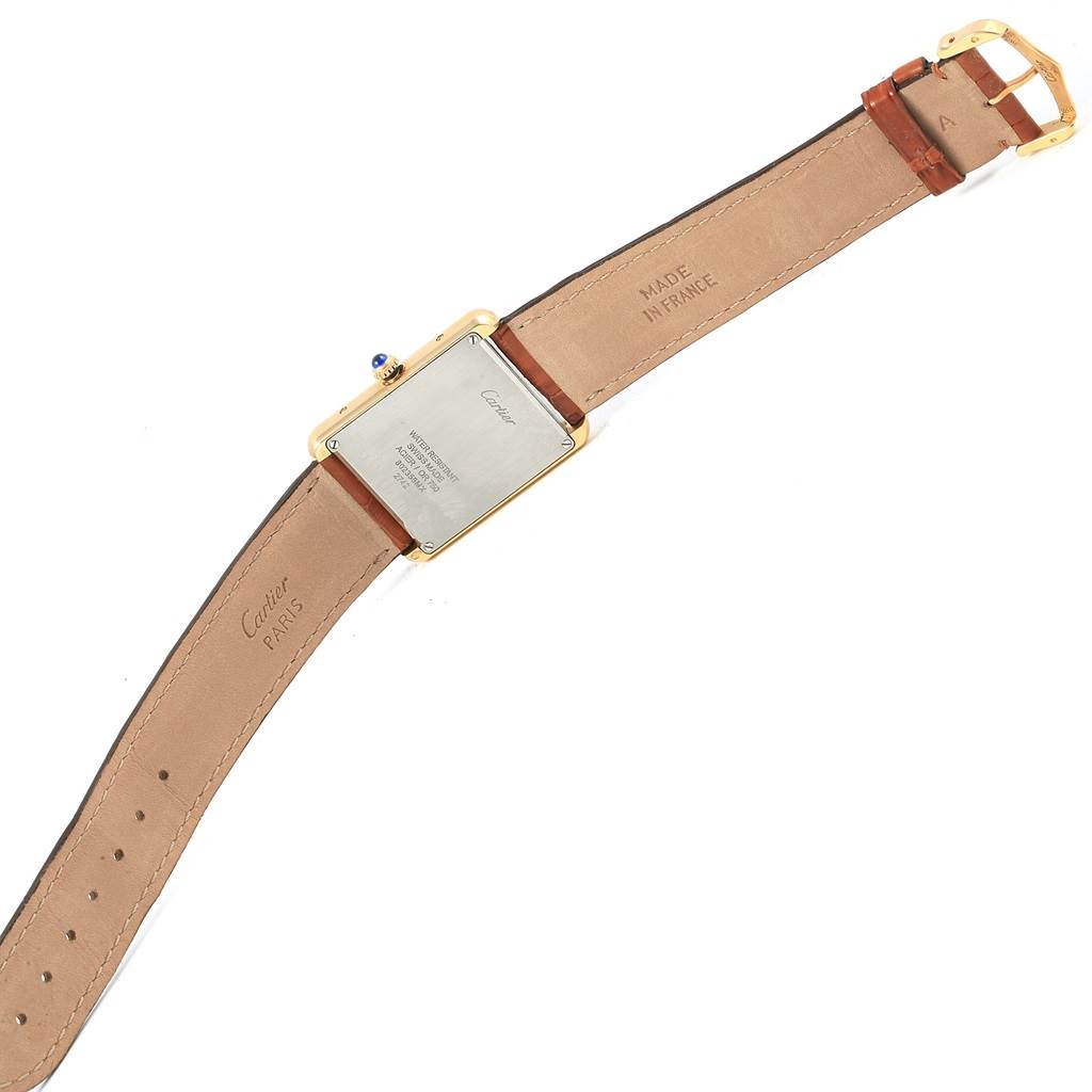 The image shows the back view of a Cartier Tank Solo W1018855 Steel and Gold (two tone) Silver Dial W1018855 Steel and Gold (two tone) Silver Dial watch, highlighting its leather strap and case back details.