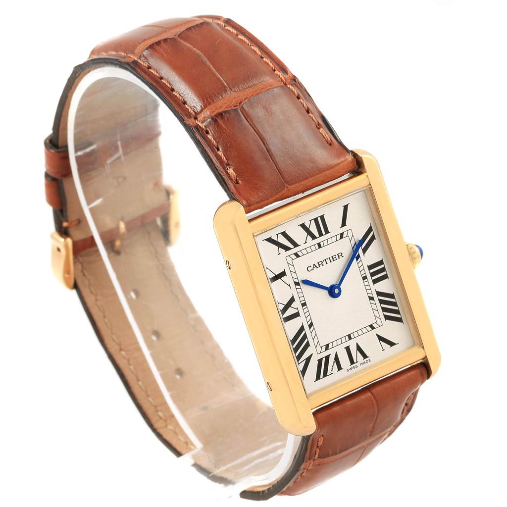 This image shows the Cartier Tank Solo W1018855 Steel and Gold (two tone) Silver Dial W1018855 Steel and Gold (two tone) Silver Dial watch angled slightly to the side, highlighting its brown leather strap and rectangular face.