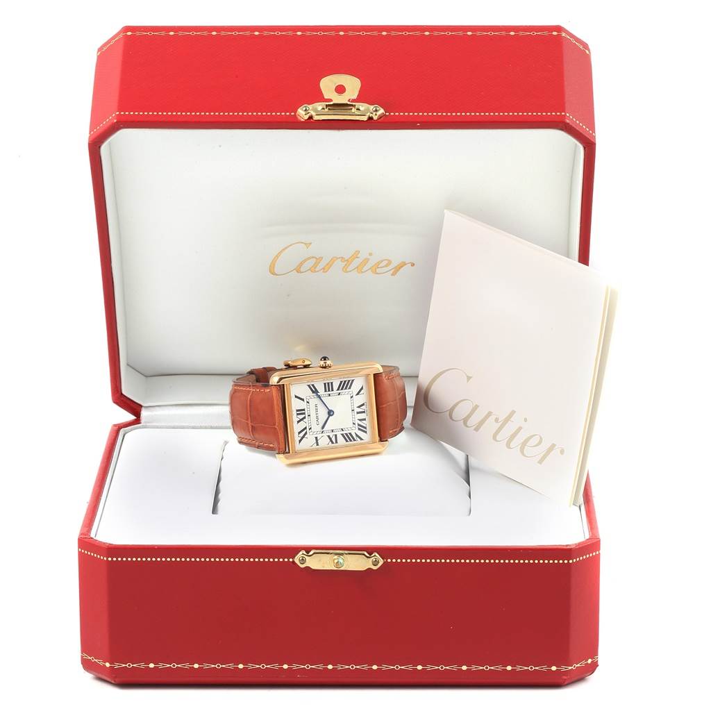 The Cartier Tank Solo W1018855 Steel and Gold (two tone) Silver Dial W1018855 Steel and Gold (two tone) Silver Dial watch is displayed frontally in an open red box, accompanied by a booklet.