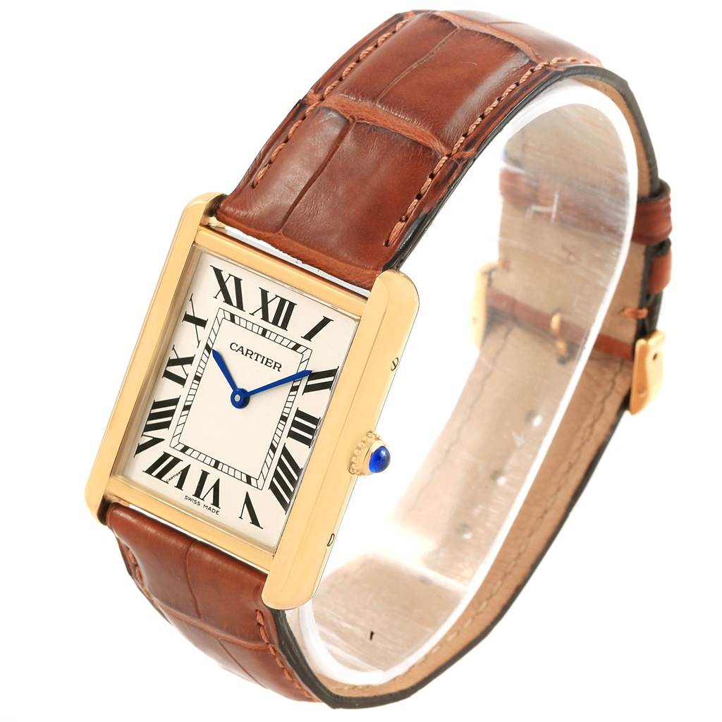 This image shows a Cartier Tank Solo W1018855 Steel and Gold (two tone) Silver Dial W1018855 Steel and Gold (two tone) Silver Dial watch of a brown leather strap, angled to display its face and band.