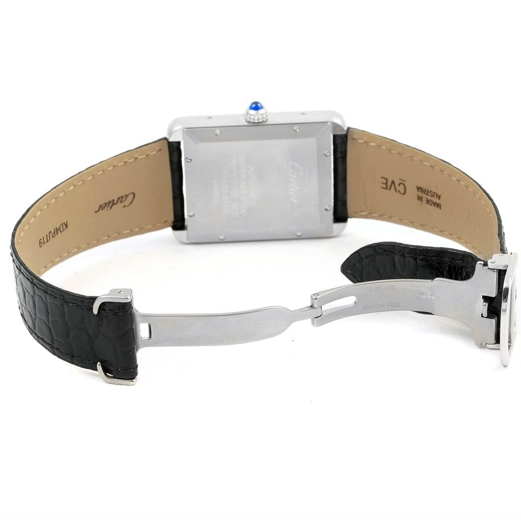 The image shows the backside and inner straps of a Tank Solo model by Cartier, displayed open with the clasp visible.