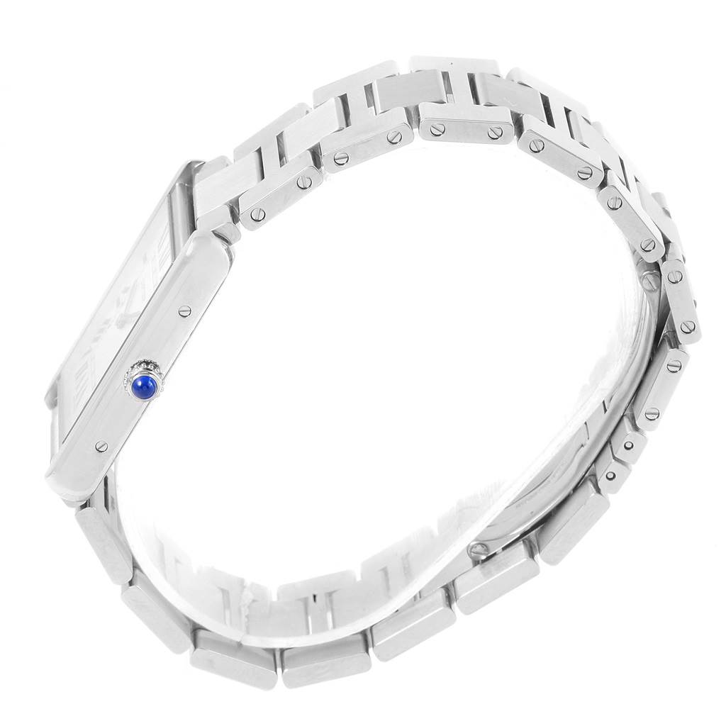 The Cartier Tank Solo W5200014 Men
s Stainless Steel Silver Dial W5200014 Men
s Stainless Steel Silver Dial watch is shown from a side angle, highlighting its metallic band and blue crown.
