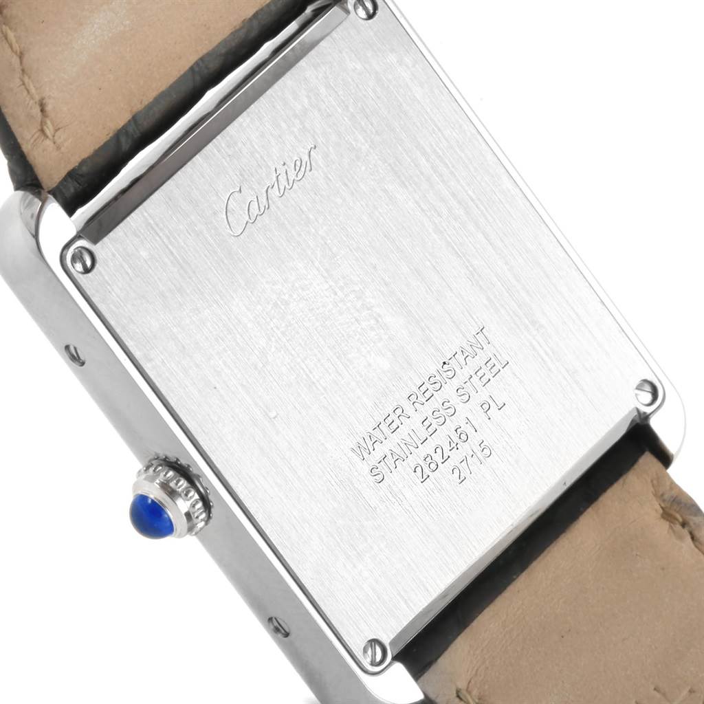 This image shows the back case of the Cartier Tank Solo W1018355 Men
s Stainless Steel Silver Dial W1018355 Men
s Stainless Steel Silver Dial watch, featuring engravings and part of the leather strap.