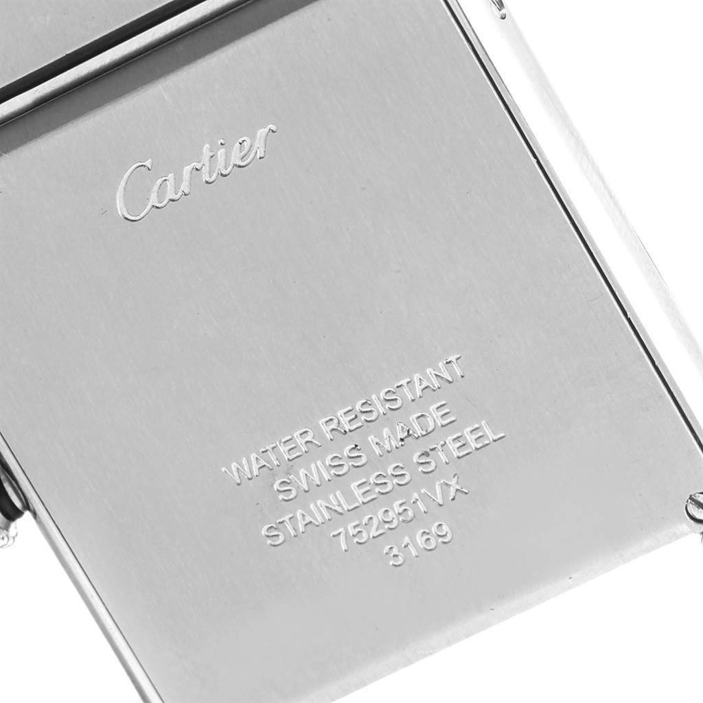 The image shows the back case of a Tank Solo model by Cartier, displaying brand engravings and specifications.