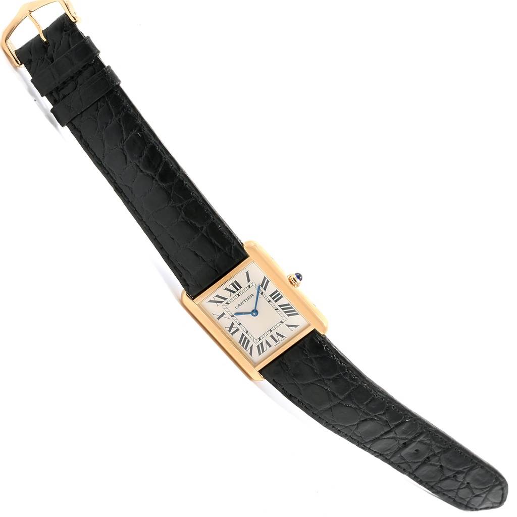 The image shows a Cartier Tank Solo W1018855 Steel and Gold (two tone) Silver Dial W1018855 Steel and Gold (two tone) Silver Dial watch angled slightly from above, displaying its rectangular face and black leather strap.