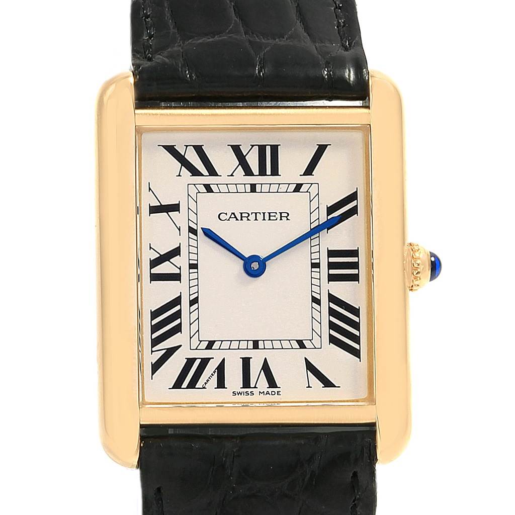 The Cartier Tank Solo W1018855 Steel and Gold (two tone) Silver Dial W1018855 Steel and Gold (two tone) Silver Dial watch is shown from a front angle, displaying its rectangular face, Roman numerals, blue hands, and black leather strap.
