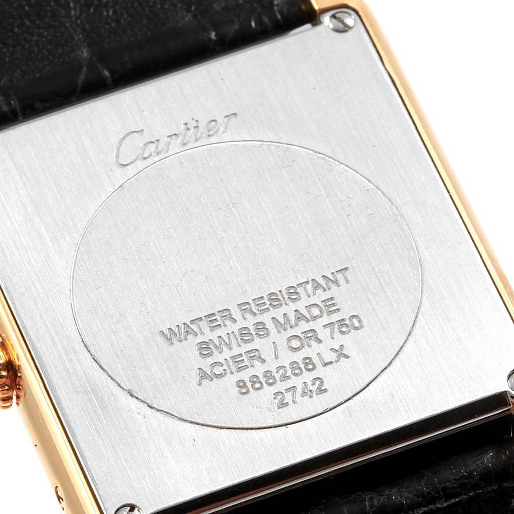 The image shows the back of a Cartier Tank Solo W1018855 Steel and Gold (two tone) Silver Dial W1018855 Steel and Gold (two tone) Silver Dial watch, highlighting the inscriptions and part of the leather strap.