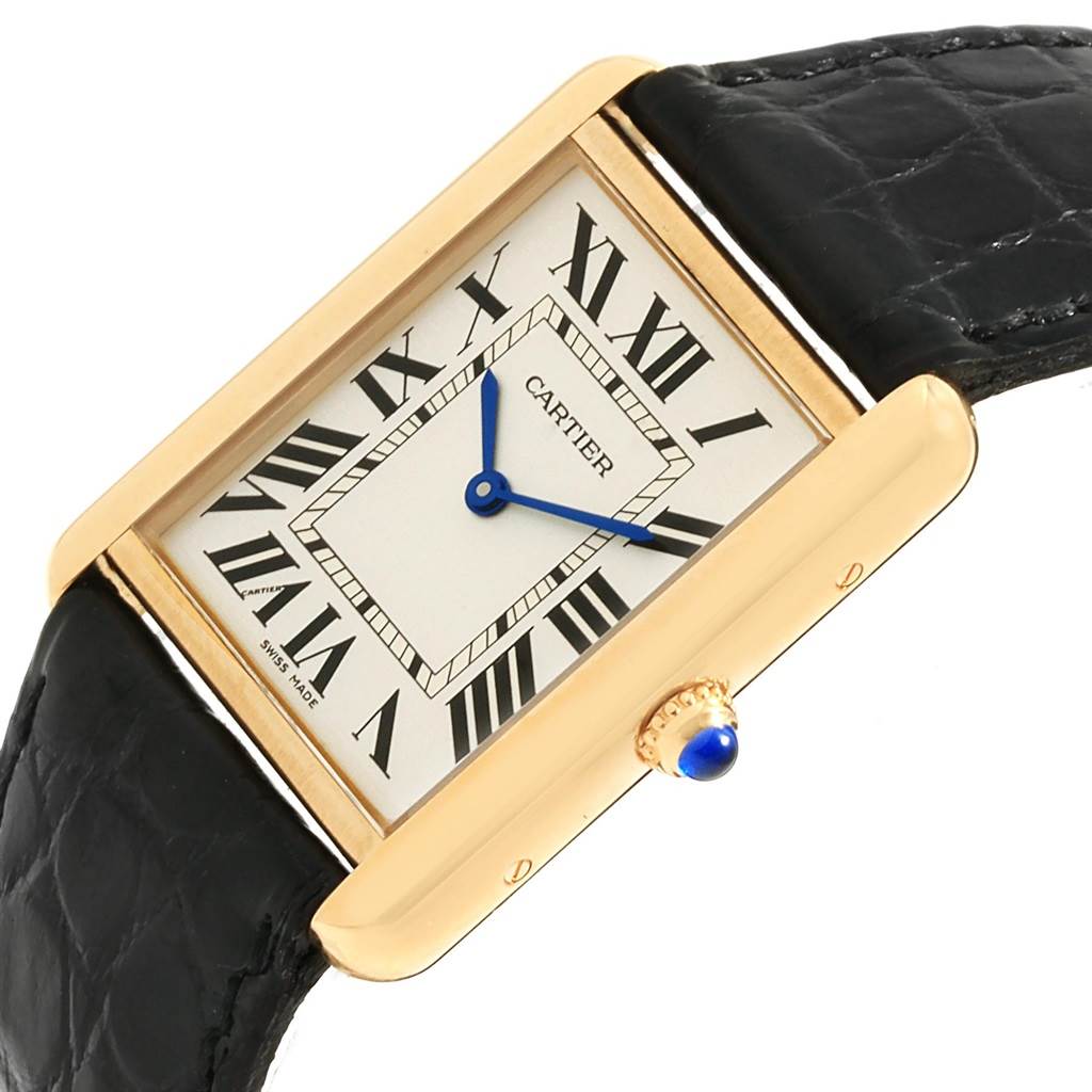 The Cartier Tank Solo W1018855 Steel and Gold (two tone) Silver Dial W1018855 Steel and Gold (two tone) Silver Dial watch is shown at a slight angle, displaying its rectangular face, Roman numerals, blue hands, and a black leather strap.