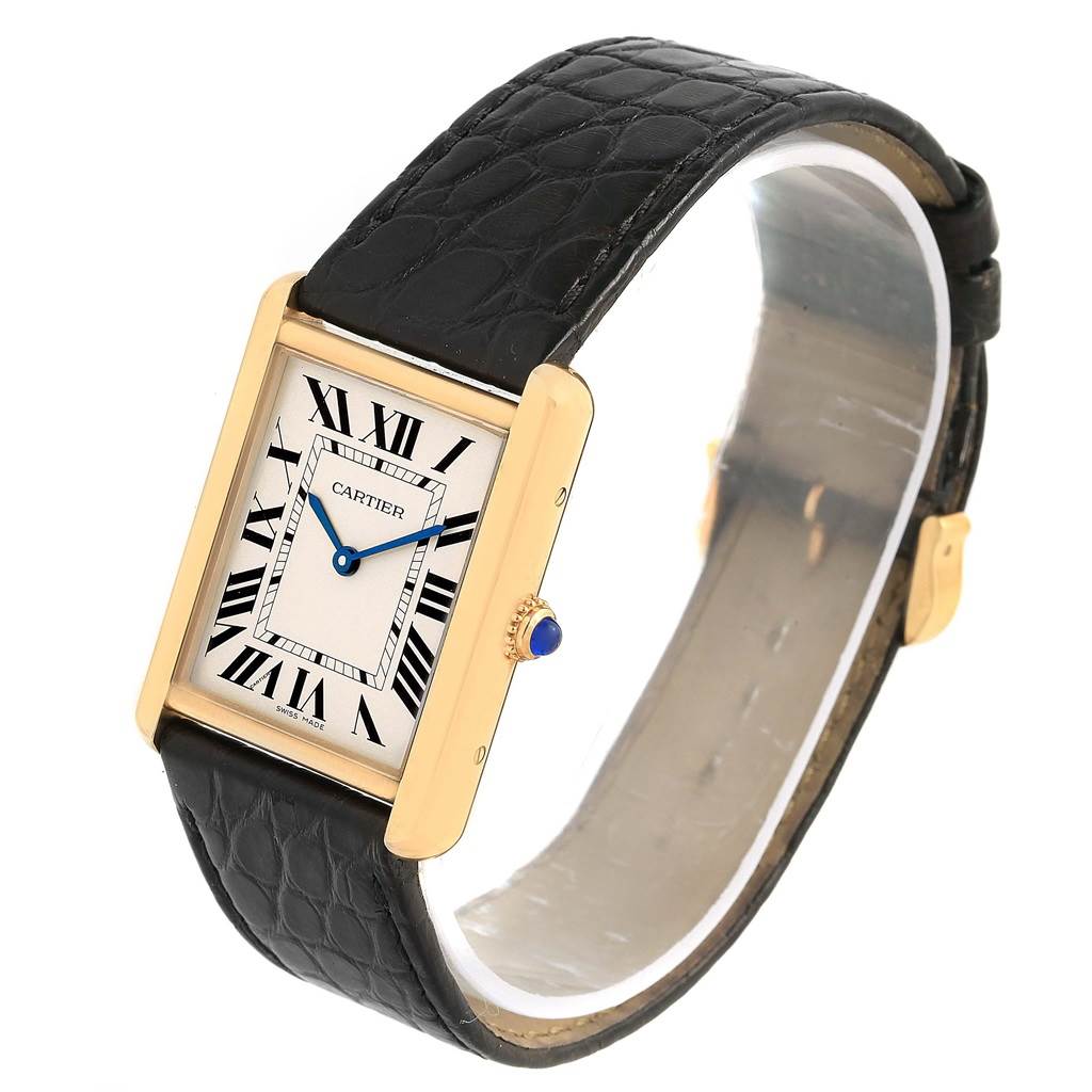 The Cartier Tank Solo W1018855 Steel and Gold (two tone) Silver Dial W1018855 Steel and Gold (two tone) Silver Dial watch is angled obliquely, showing its rectangular face, Roman numerals, black leather strap, and gold casing.