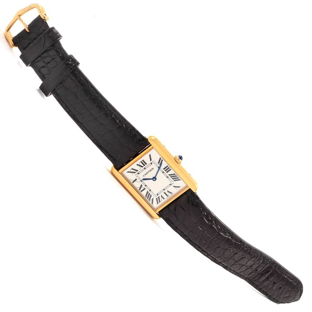 The image shows a Cartier Tank Solo W1018855 Steel and Gold (two tone) Silver Dial W1018855 Steel and Gold (two tone) Silver Dial watch from a top-down angle, highlighting its rectangular face and black leather strap.