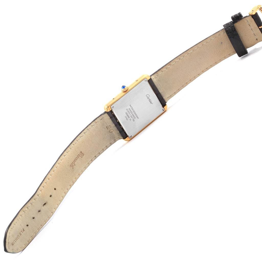 The image shows the back view of a Cartier Tank Solo W1018855 Steel and Gold (two tone) Silver Dial W1018855 Steel and Gold (two tone) Silver Dial watch, highlighting the case back, strap, and clasp.