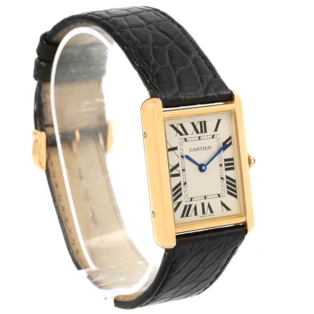 This image shows a Cartier Tank Solo W1018855 Steel and Gold (two tone) Silver Dial W1018855 Steel and Gold (two tone) Silver Dial watch at a slight angle, emphasizing its face, black leather strap, and gold casing.