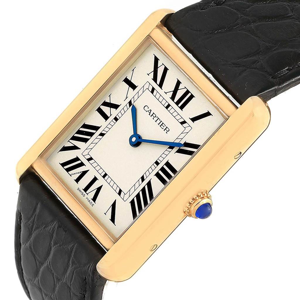 The Cartier Tank Solo W1018855 Steel and Gold (two tone) Silver Dial W1018855 Steel and Gold (two tone) Silver Dial watch is shown at an angle, displaying the face with Roman numerals and a black leather strap.