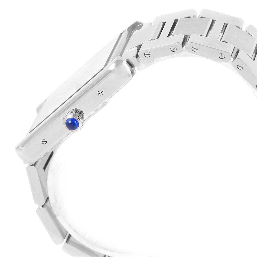 The image shows a side view of the Cartier Tank Solo W5200028 Men
s Stainless Steel Silver Dial W5200028 Men
s Stainless Steel Silver Dial watch, highlighting the bracelet and blue cabochon crown.