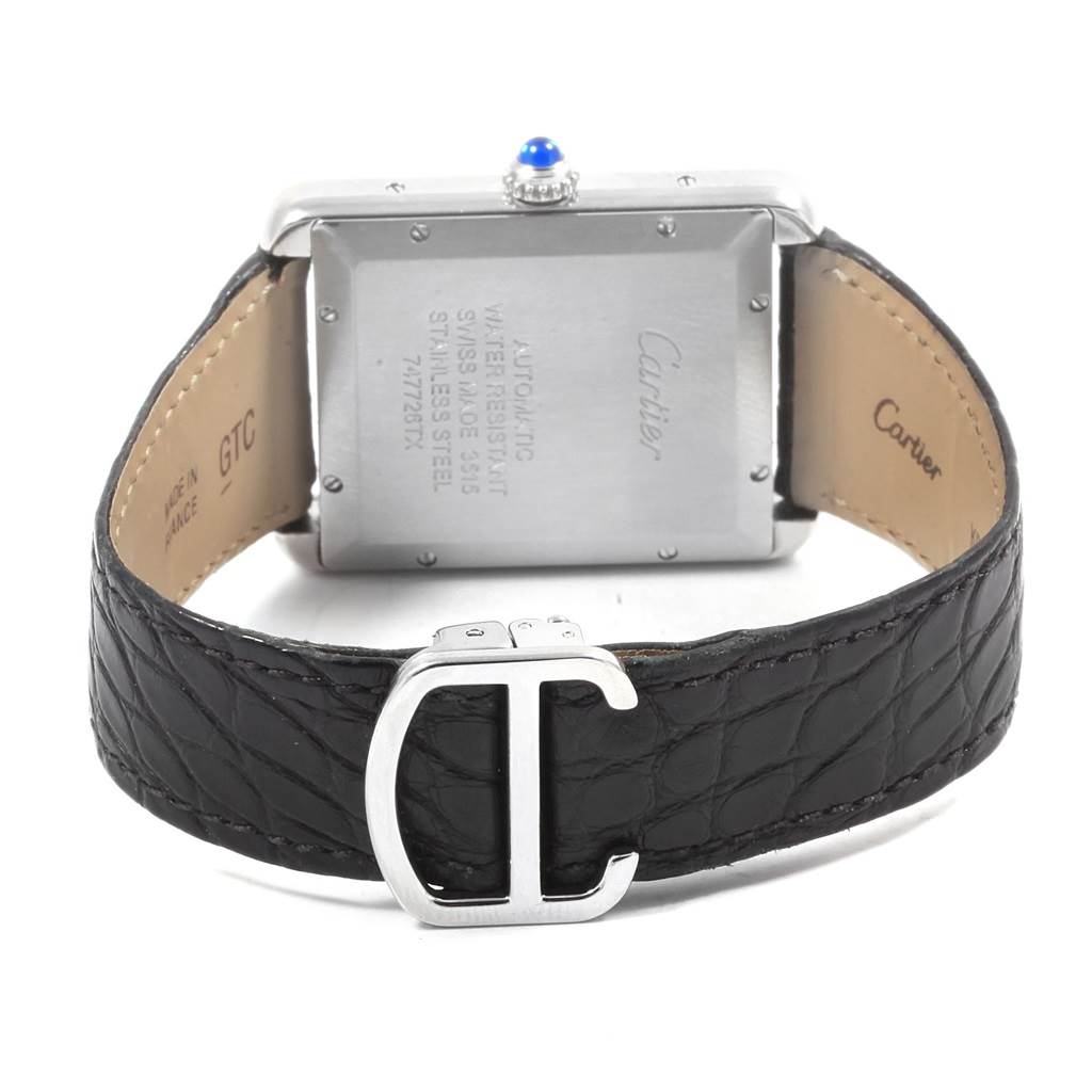 The image shows the back case and leather strap with a 
C
 buckle of the Tank Solo watch by Cartier.