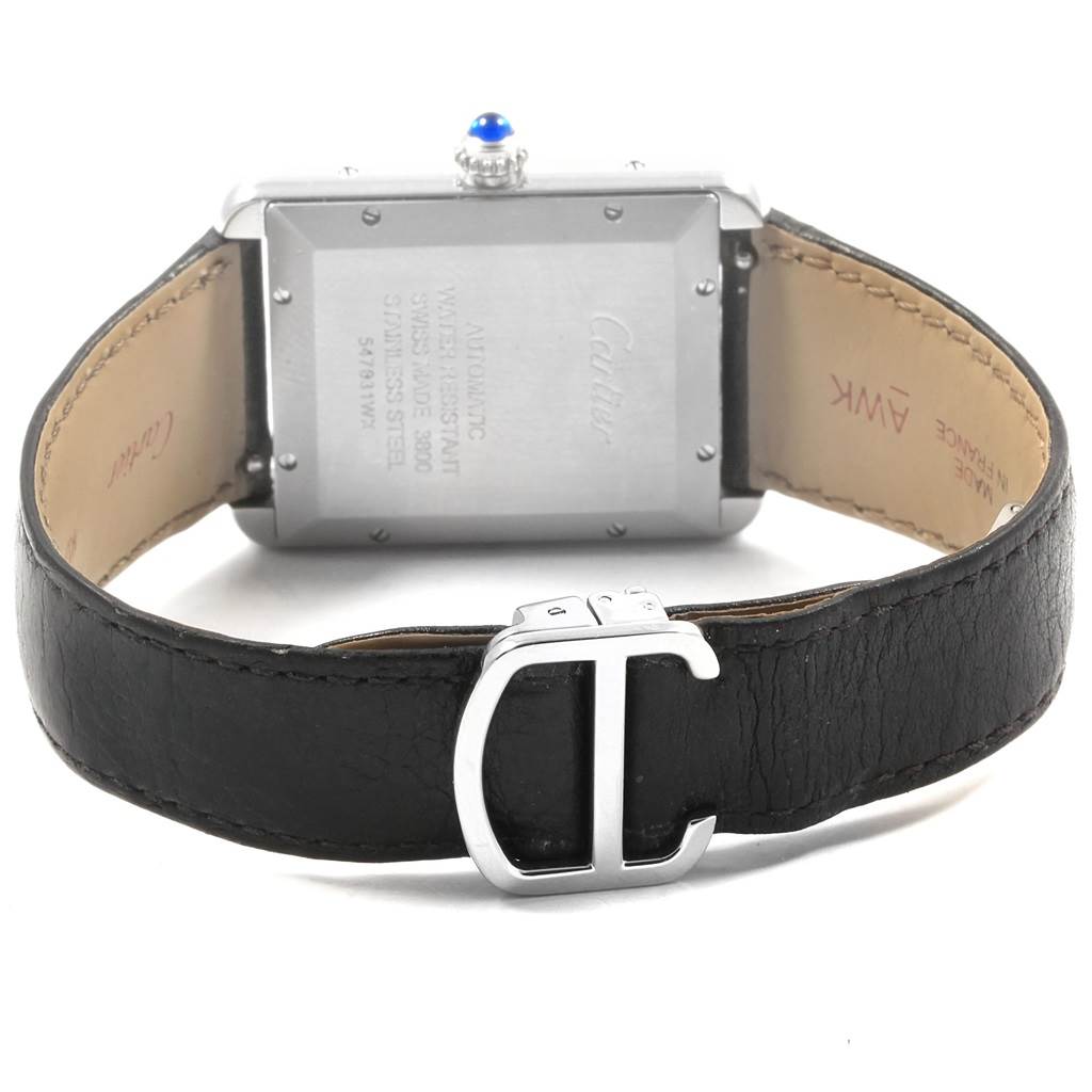 The image shows the back of a Tank Solo model watch by Cartier, highlighting the case back and leather strap with buckle.