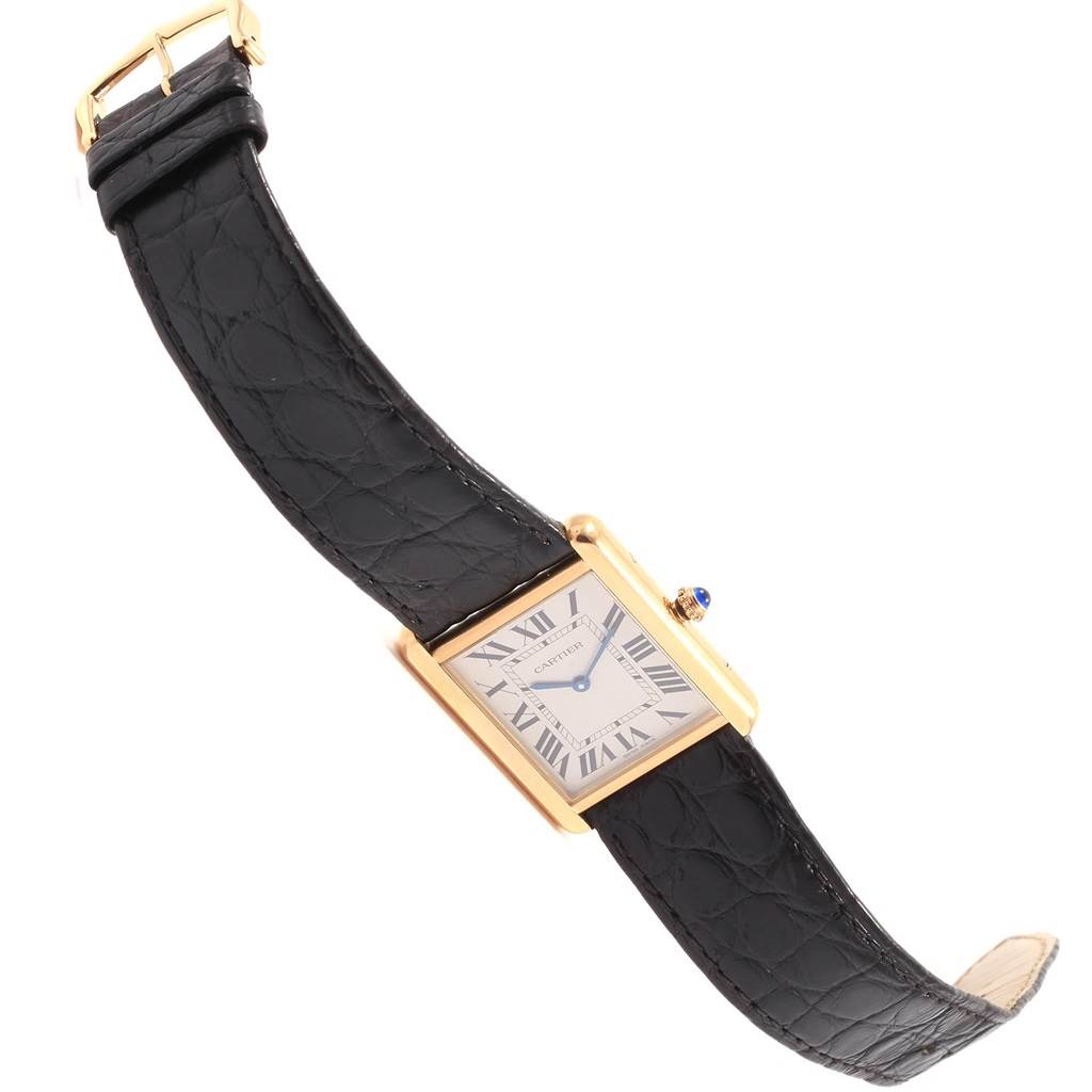 The image shows a Cartier Tank Solo W1018855 Men
s Steel and Gold (two tone) Silver Dial W1018855 Men
s Steel and Gold (two tone) Silver Dial model watch at an angled view, highlighting the rectangular face, black leather strap, and gold-tone case.