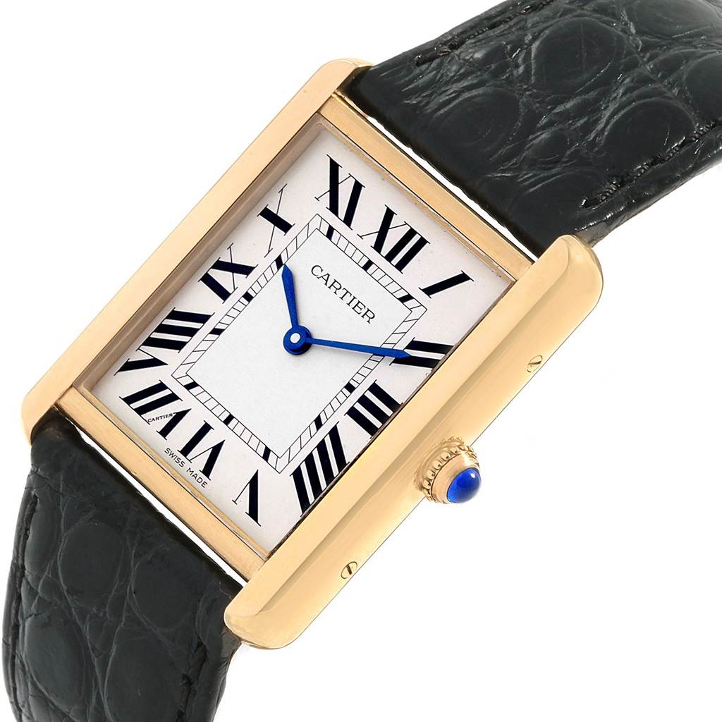 The image shows a Cartier Tank Solo W1018855 Men
s Steel and Gold (two tone) Silver Dial W1018855 Men
s Steel and Gold (two tone) Silver Dial watch at an angled top-down view, displaying the face, crown, and part of the black leather strap.