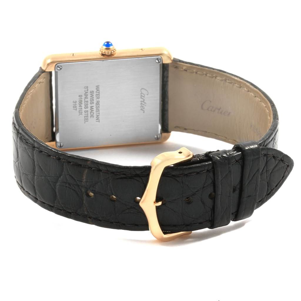 This image shows the back and buckle of the Cartier Tank Solo W1018855 Men
s Steel and Gold (two tone) Silver Dial W1018855 Men
s Steel and Gold (two tone) Silver Dial watch, showcasing the case back, crown, and leather strap.