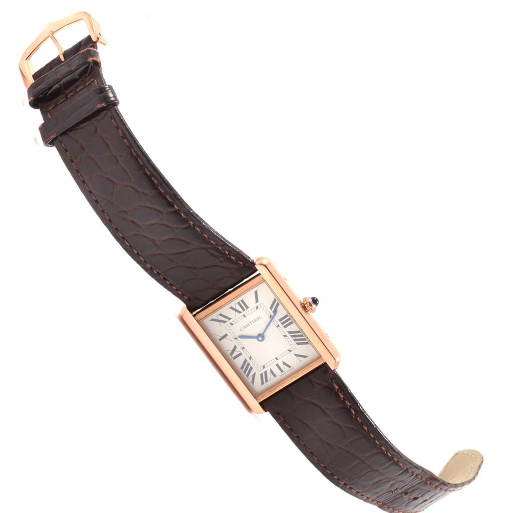 The image shows a Cartier Tank Solo W5200025 Men
s Steel and Gold (two tone) Silver Dial W5200025 Men
s Steel and Gold (two tone) Silver Dial watch at an angled view, displaying its rectangular face, Roman numerals, and leather strap.