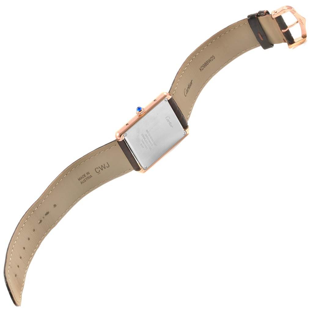 The image shows the back view of a Cartier Tank Solo W5200025 Men
s Steel and Gold (two tone) Silver Dial W5200025 Men
s Steel and Gold (two tone) Silver Dial watch, revealing the case back and leather strap.