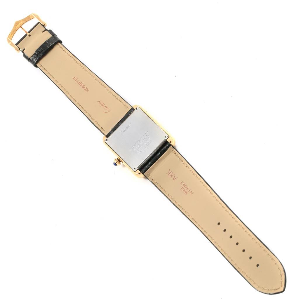 This Cartier Tank Solo W1018855 Men's Steel and Gold (two tone) Silver Dial W1018855 Men's Steel and Gold (two tone) Silver Dial watch is shown from the back, displaying the case back, leather straps, and buckle parts.