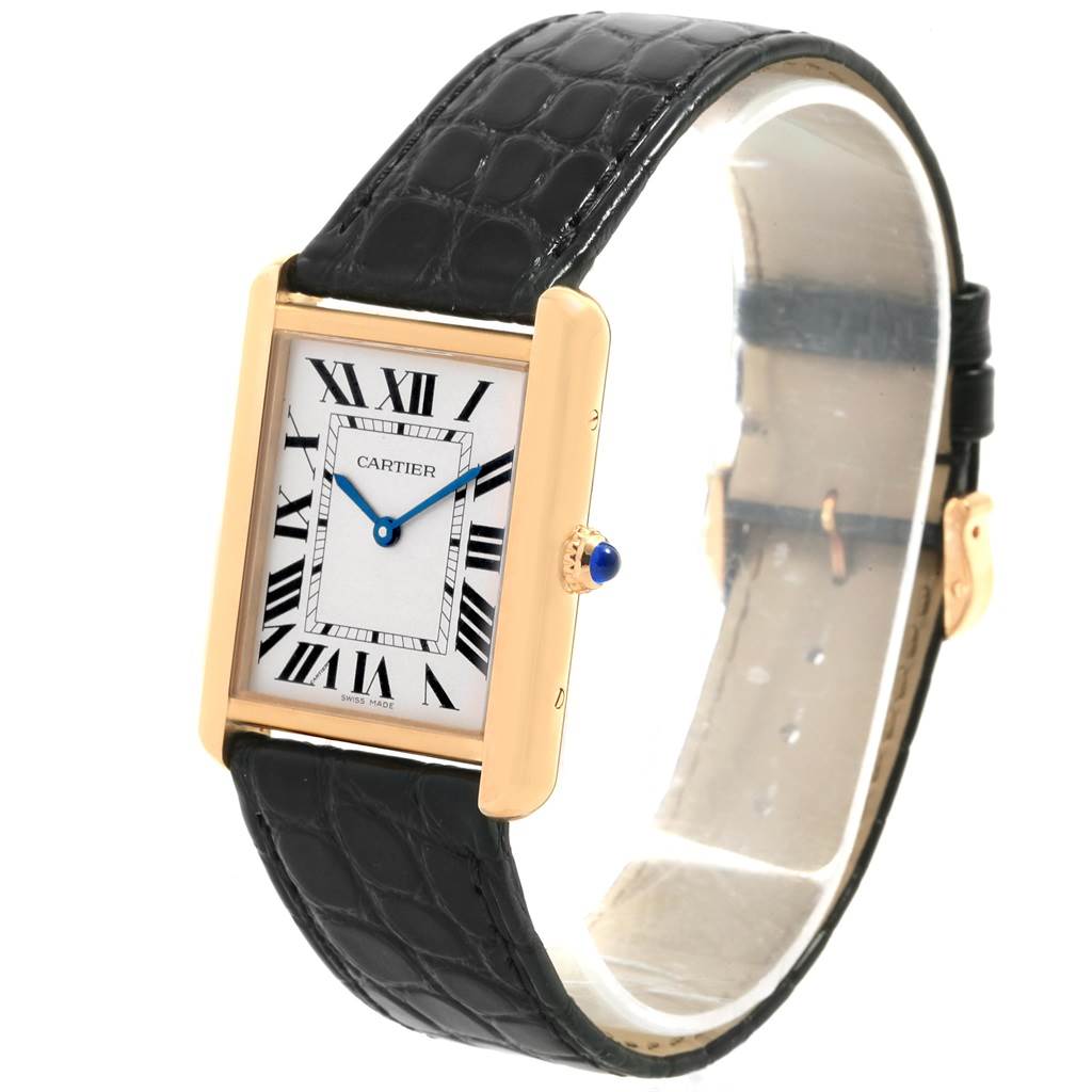 The Cartier Tank Solo W1018855 Men's Steel and Gold (two tone) Silver Dial W1018855 Men's Steel and Gold (two tone) Silver Dial watch is shown at a three-quarter angle, highlighting the rectangular face, black leather strap, and gold casing.