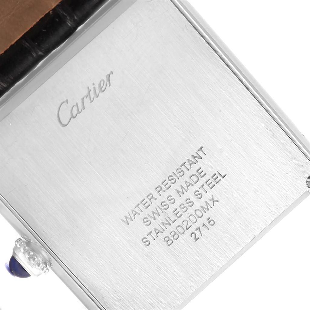 The image shows the back case and part of the crown of a Cartier Tank Solo W1018355 Men
s Stainless Steel Silver Dial W1018355 Men
s Stainless Steel Silver Dial watch at an angled view.