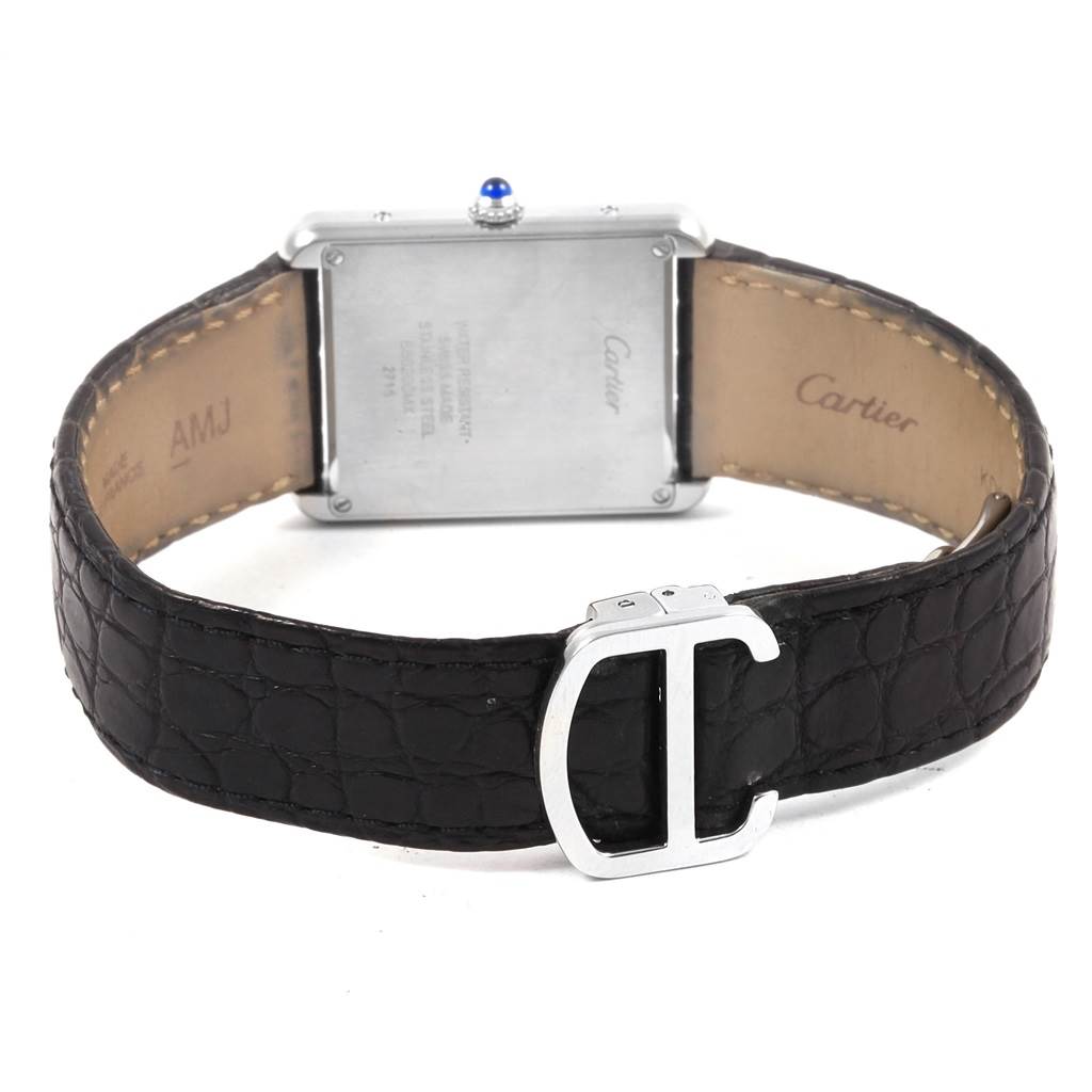 The image shows the back view of a Cartier Tank Solo W1018355 Men
s Stainless Steel Silver Dial W1018355 Men
s Stainless Steel Silver Dial watch, highlighting the case, crown, and leather strap with a buckle.