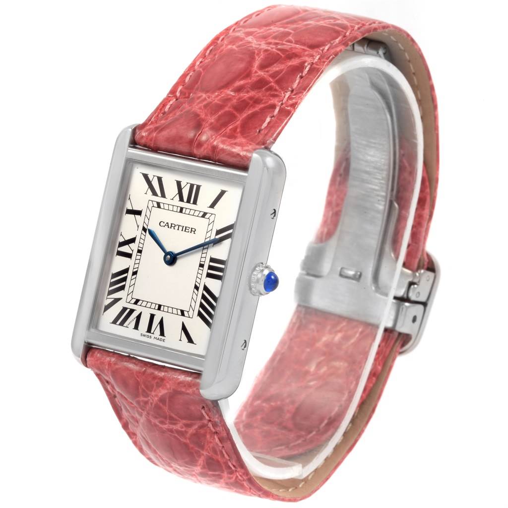 This image shows a front angled view of the Cartier Tank Solo W1018355 Men
s Stainless Steel Silver Dial W1018355 Men
s Stainless Steel Silver Dial watch with a red leather strap and a rectangular face.