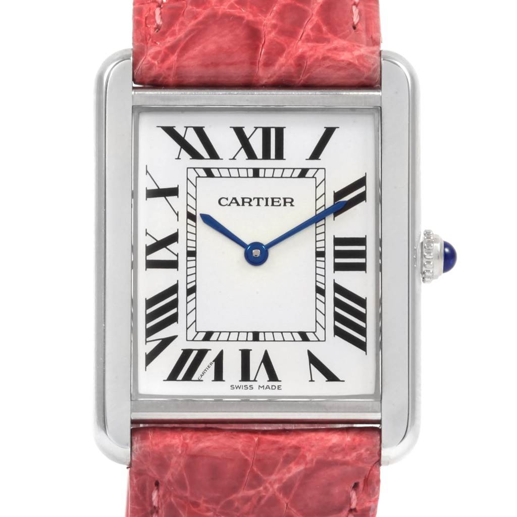 The image shows a frontal view of the Cartier Tank Solo W1018355 Men
s Stainless Steel Silver Dial W1018355 Men
s Stainless Steel Silver Dial watch, highlighting the dial, Roman numerals, and a portion of the pink leather strap.