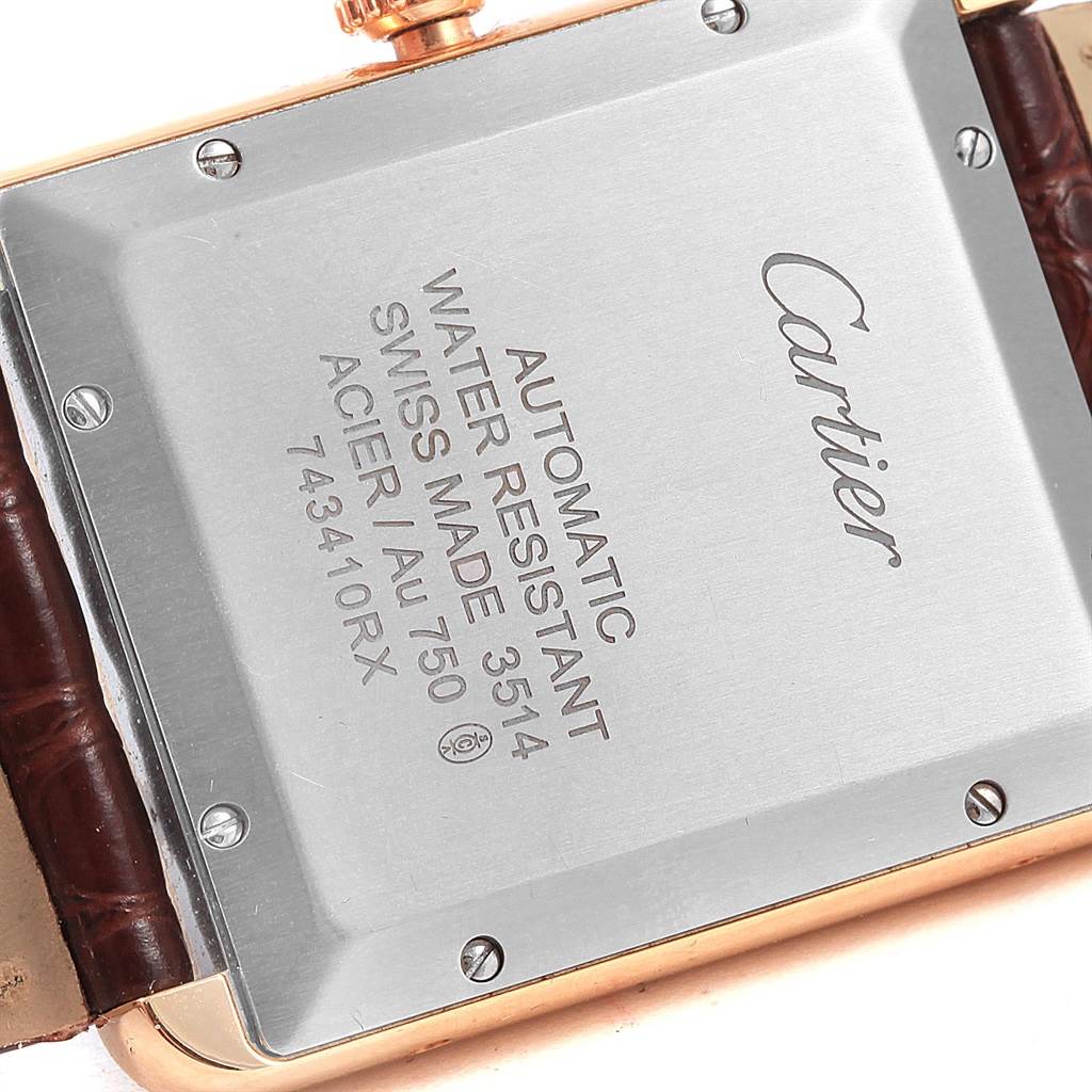 The image shows the back case of the Cartier Tank Solo W5200026 Men
s Steel and Gold (two tone) Silver Dial W5200026 Men
s Steel and Gold (two tone) Silver Dial watch, displaying engravings and part of the strap.