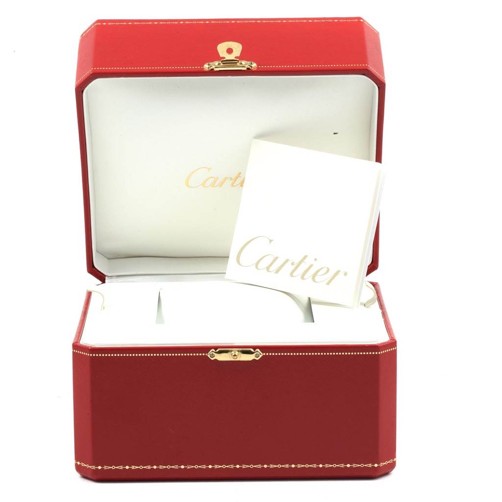 The image shows a Cartier Tank Solo W5200026 Men
s Steel and Gold (two tone) Silver Dial W5200026 Men
s Steel and Gold (two tone) Silver Dial model watch box and instruction manual inside an open red case.