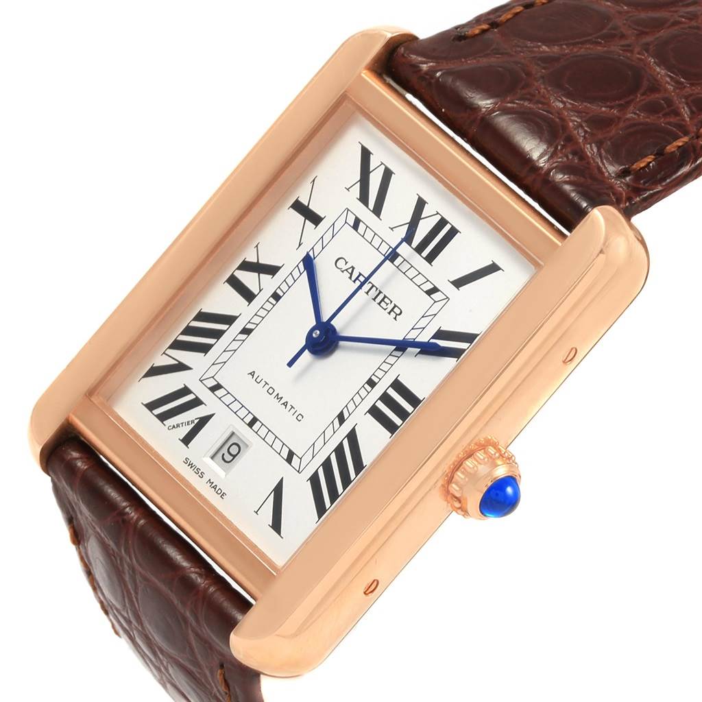 The image shows a Cartier Tank Solo W5200026 Men
s Steel and Gold (two tone) Silver Dial W5200026 Men
s Steel and Gold (two tone) Silver Dial watch at an angle highlighting its face, crown, and part of the leather strap.