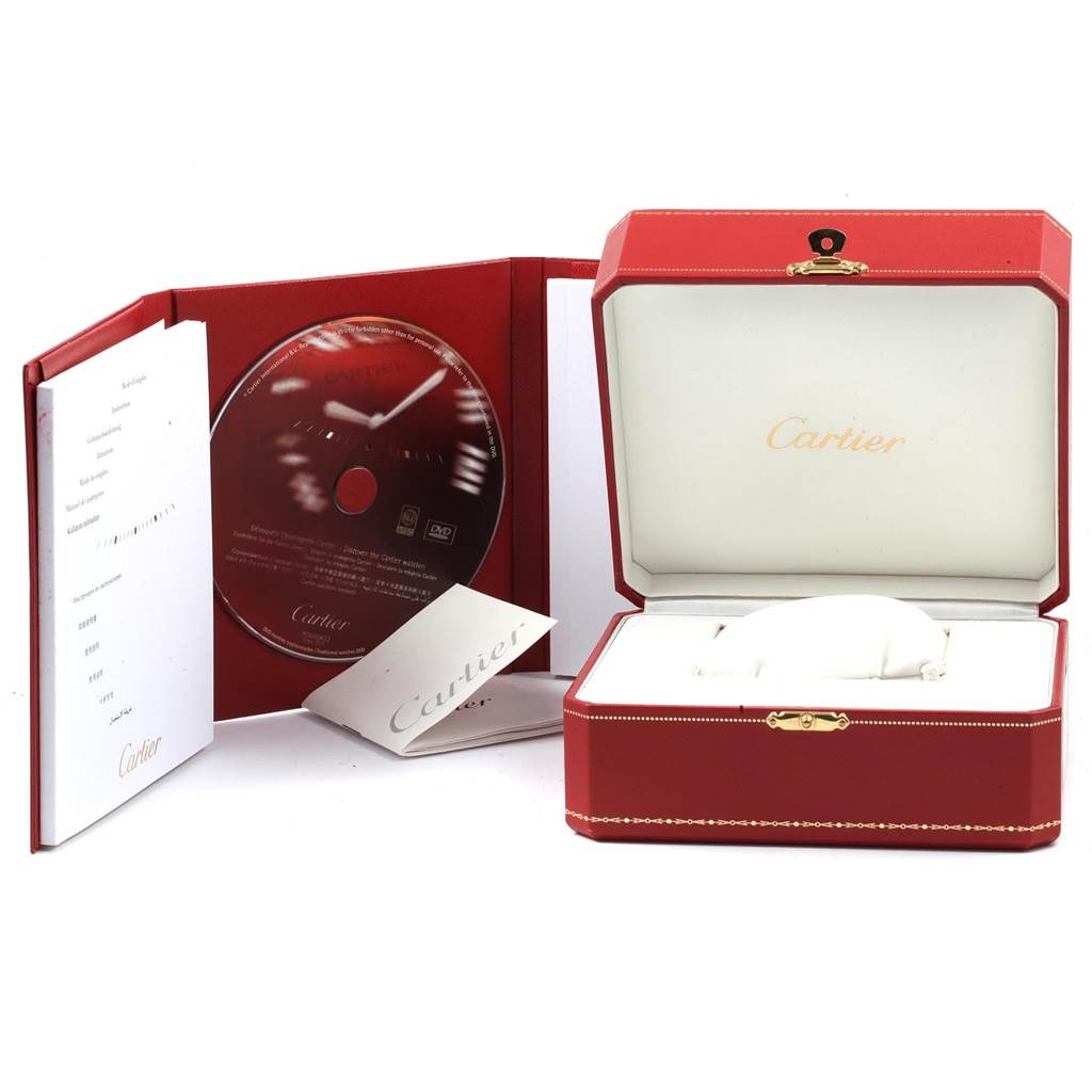 The image shows the packaging for a Cartier Tank Solo W5200014 Men
s Stainless Steel Silver Dial W5200014 Men
s Stainless Steel Silver Dial model, including the box, a booklet, and a CD.