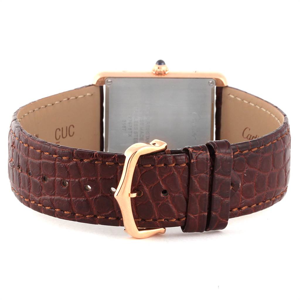 The image shows the back view of the Cartier Tank Solo W5200025 Men
s Steel and Gold (two tone) Silver Dial W5200025 Men
s Steel and Gold (two tone) Silver Dial watch with a brown leather strap and the clasp visible.